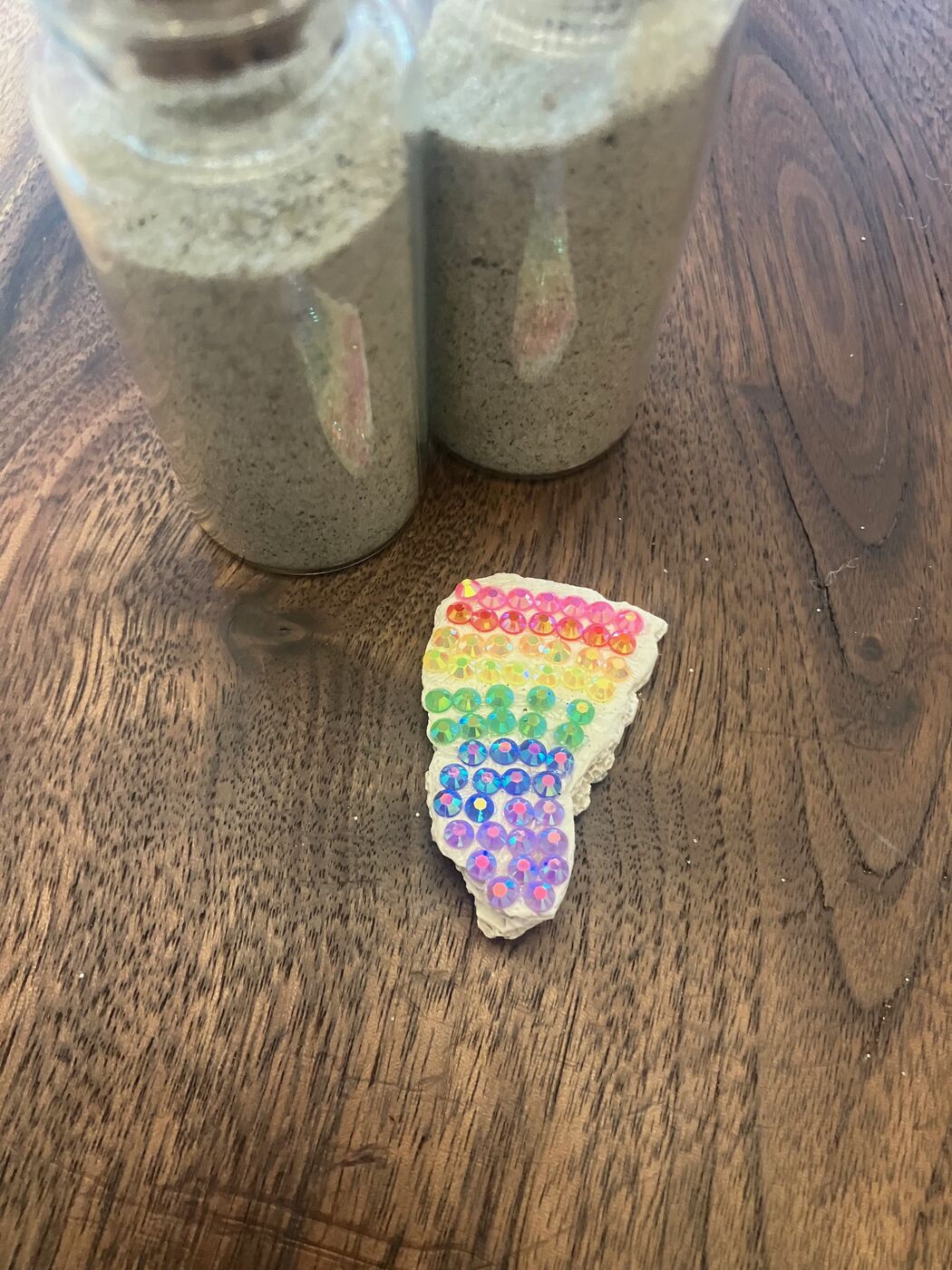 Shell painted with a rainbow of tiny dots