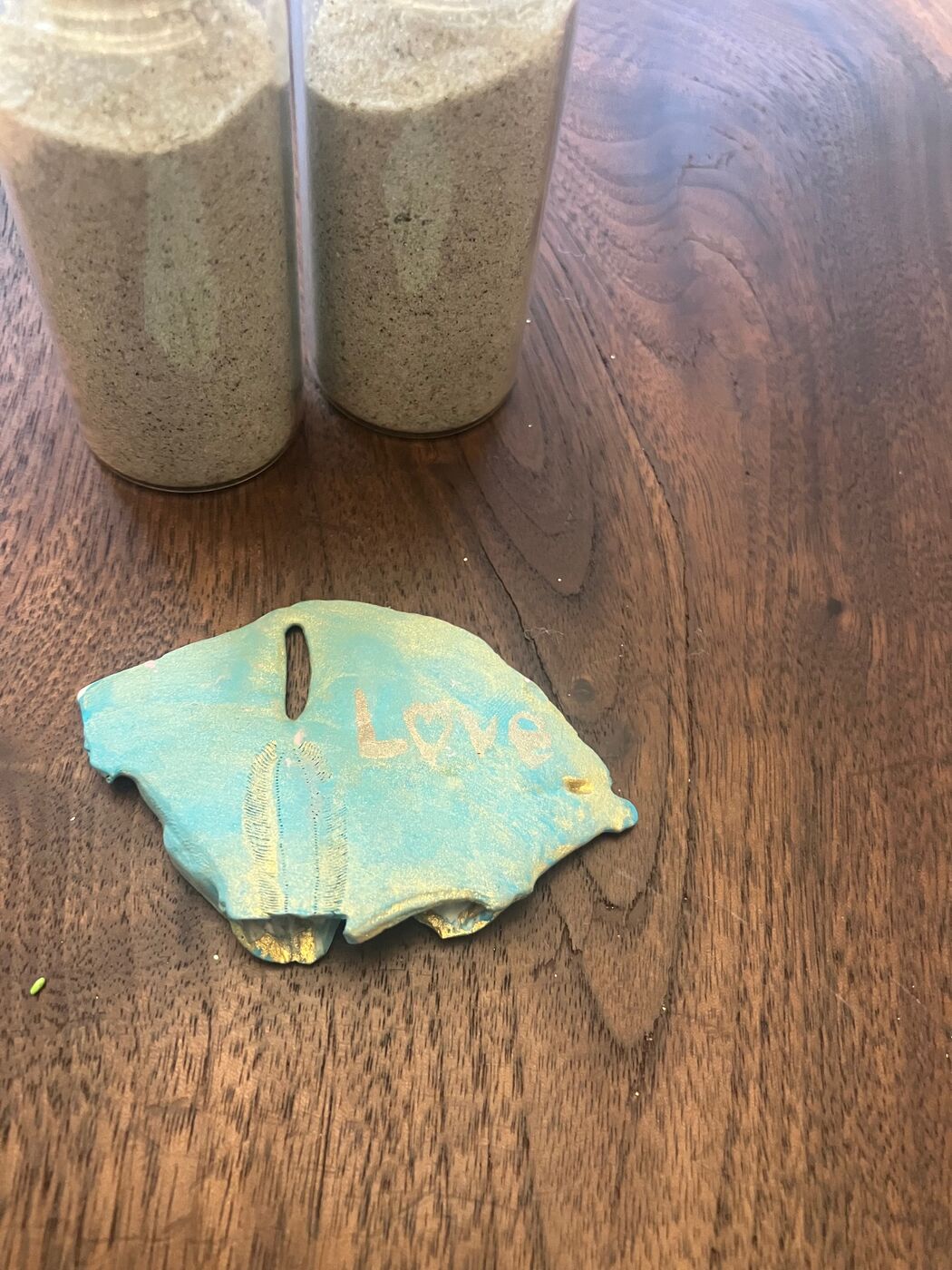 Teal shell painted with golden details