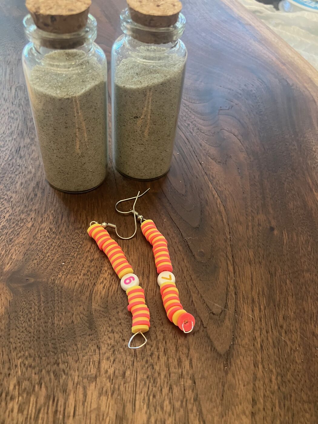 Warm orange beaded dangle earrings