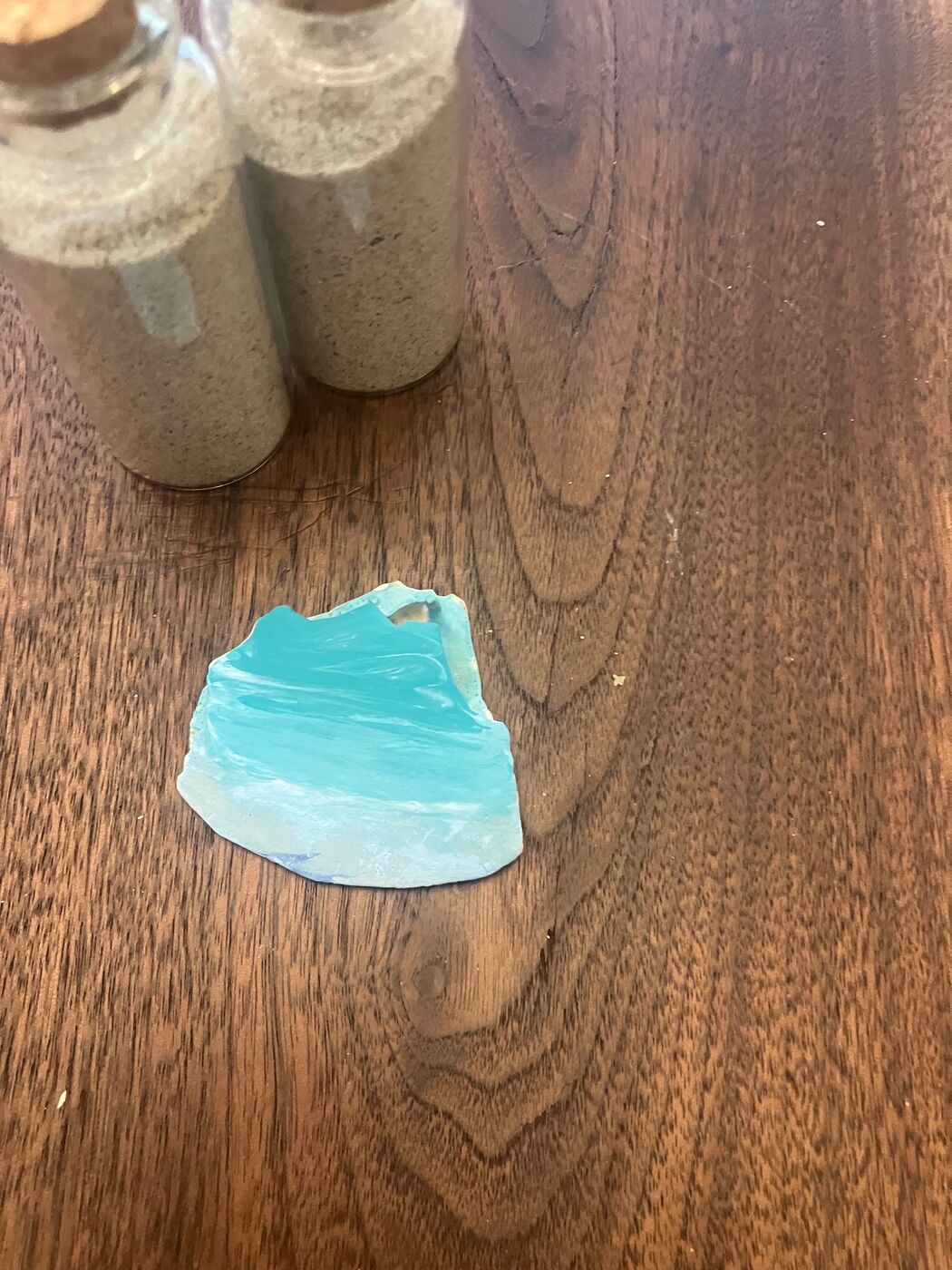 Shell painted in teal-and-white ombre like sea glass